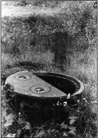 Document 48. Close-up view of the manhole of document 47