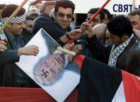 Pro-Palestinian Protesters with portrait of Sharon